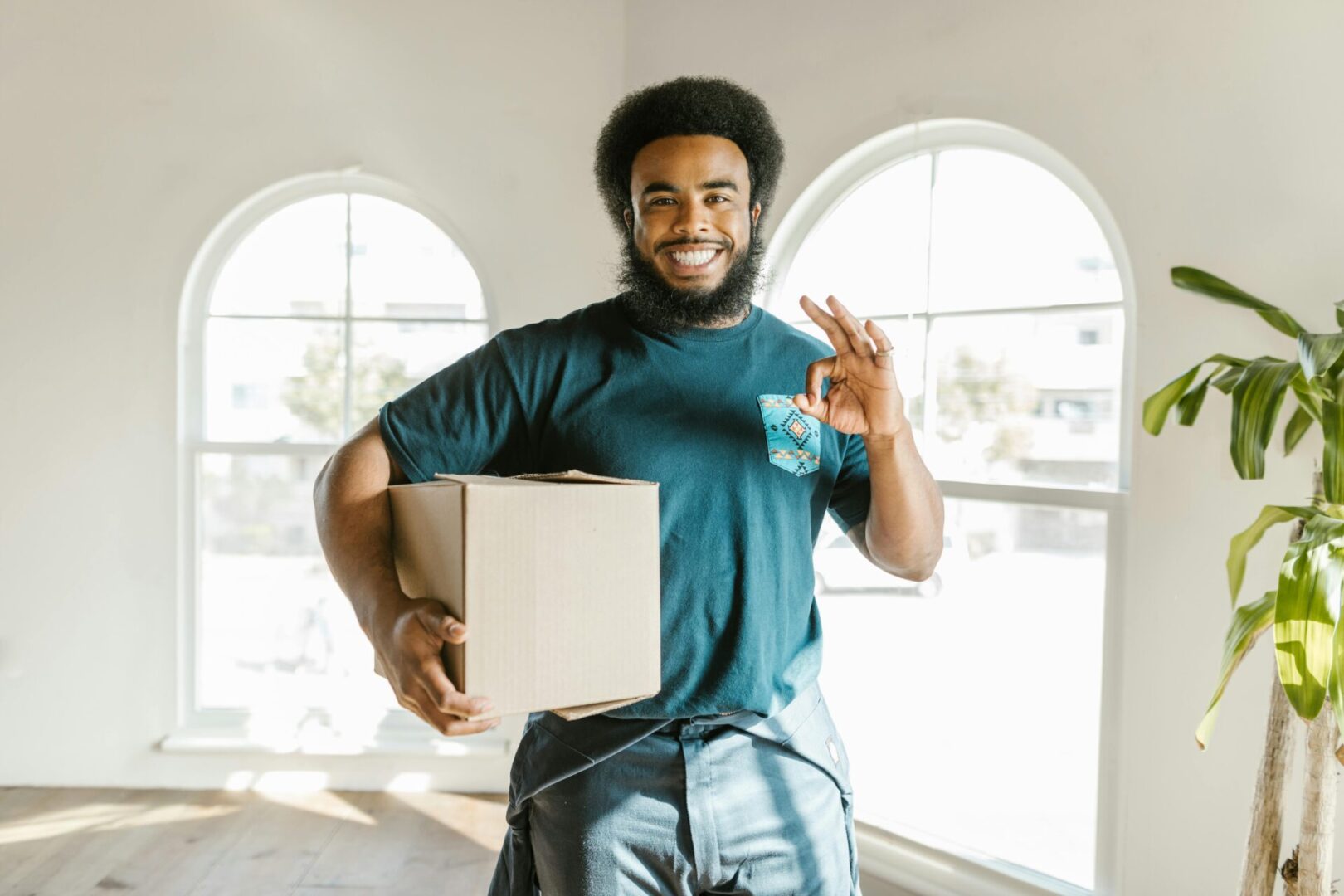 A man holding a box in his hand.