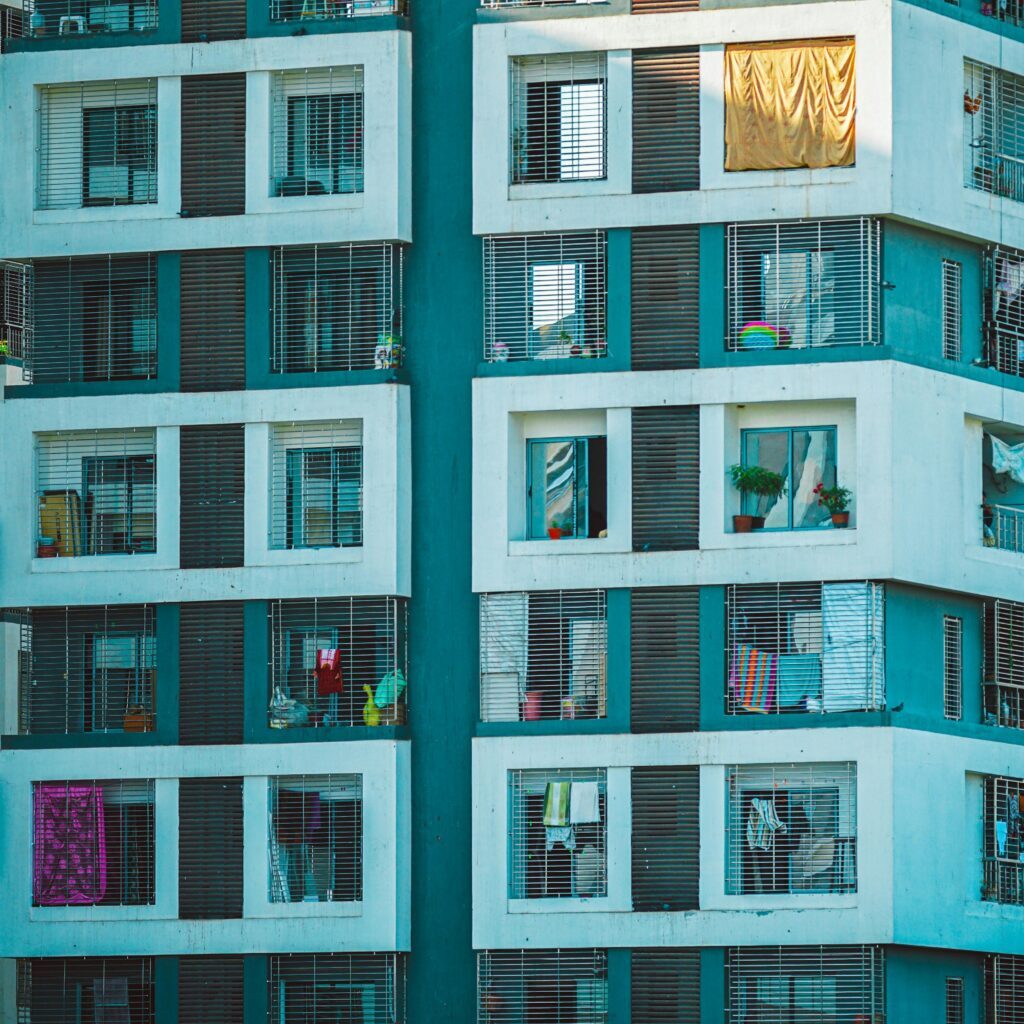 A building with many windows and some people in it